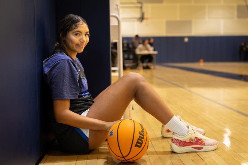 Los Angeles, CA - December 03: Shiloh Johnson, a freshman basketball player at Windward High and the last of legendary basketball player Marques Johnson, poses for a portrait on Tuesday, Dec. 3, 2024 in Los Angeles, CA. (Jason Armond / Los Angeles Times)