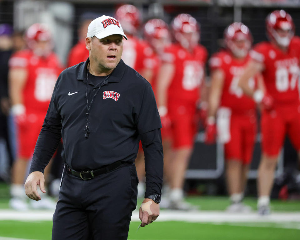 LAS VEGAS, NEVADA - NOVEMBER 30: Head coach Barry Odom of the UNLV Rebels walks on the field during warmups before a game against the Nevada Wolf Pack at Allegiant Stadium on November 30, 2024 in Las Vegas, Nevada. The Rebels defeated the Wolf Pack 38-14. (Photo by Ethan Miller/Getty Images)