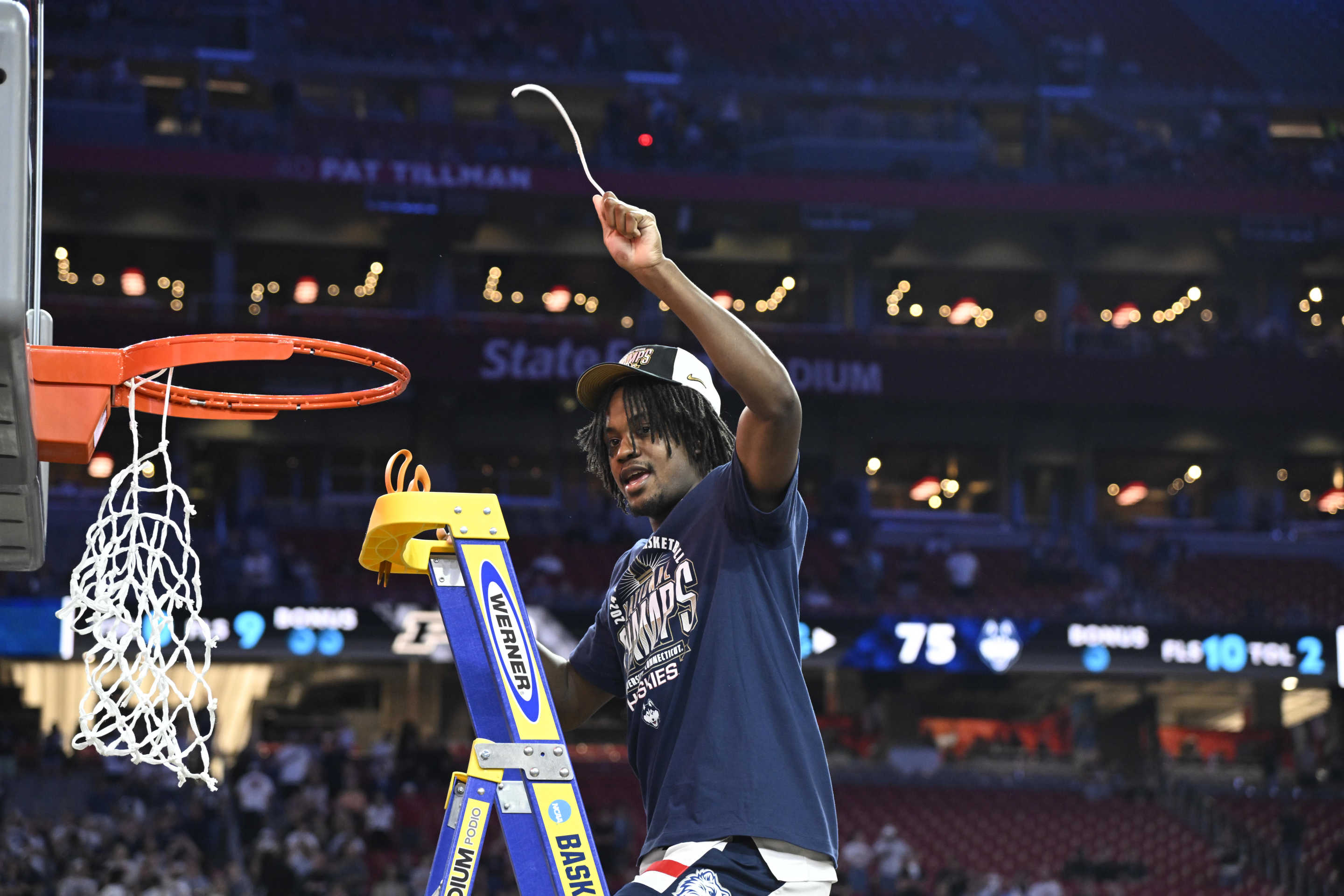 College Basketball: NCAA Final Four: UConn Tristen Newton (2) in action, cuts down the nets and celebrates victory vs Purdue during the NCAA Men's Basketball Tournament National Championship game at State Farm Stadium. Glendale, AZ 4/8/2024 CREDIT: Greg Nelson (Photo by Greg Nelson/Sports Illustrated via Getty Images) (Set Number: X00004 TK1)