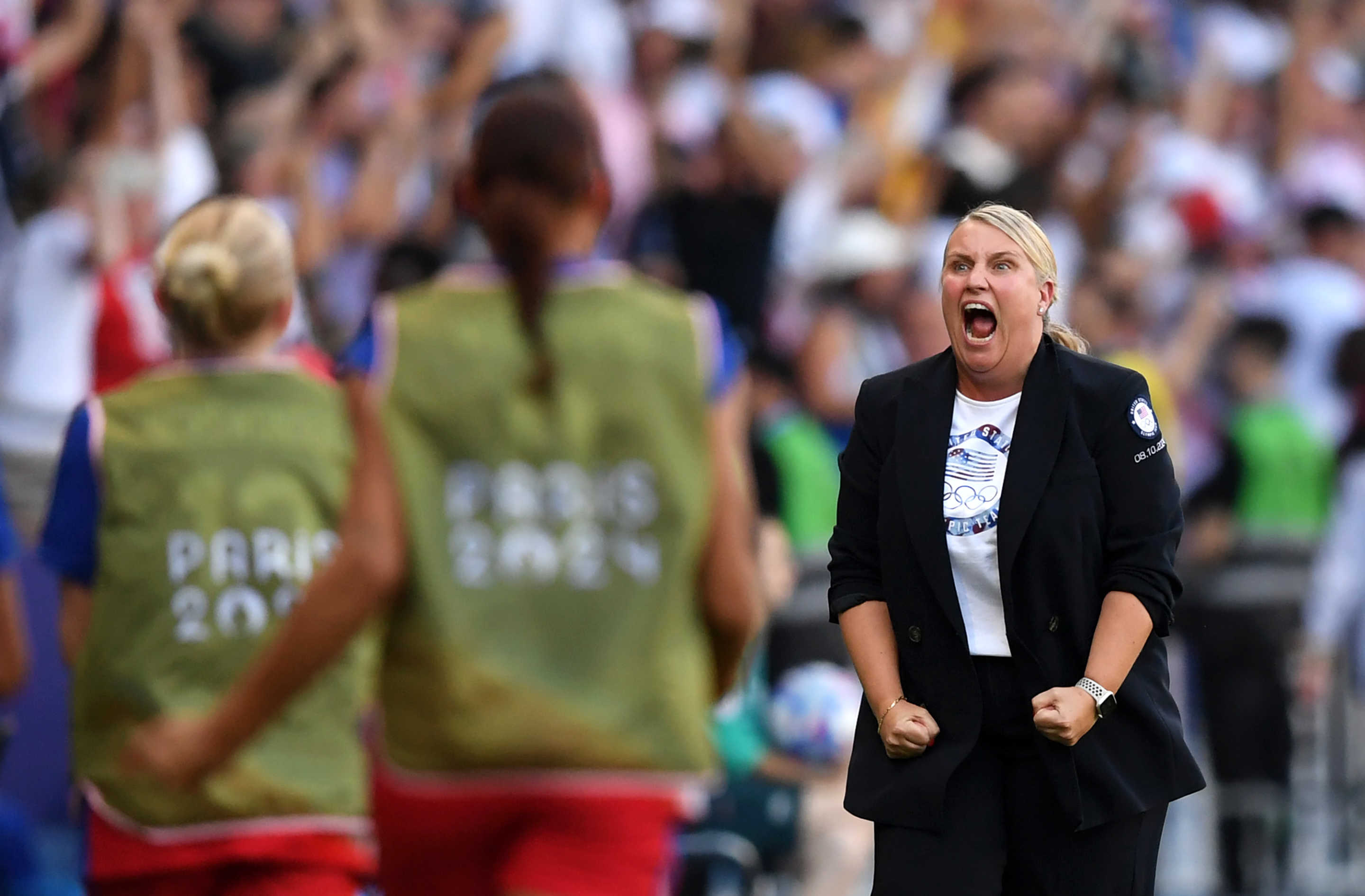 PARIS, FRANCE - AUGUST 10: Emma Hayes, Head Coach of Team United States celebrates after Mallory Swanson #9 of Team United States (not pictured) scores her team's first goal during the Women's Gold Medal match between Brazil and United States of America during the Olympic Games Paris 2024 at Parc des Princes on August 10, 2024 in Paris, France. (Photo by Harriet Lander - FIFA/FIFA via Getty Images)