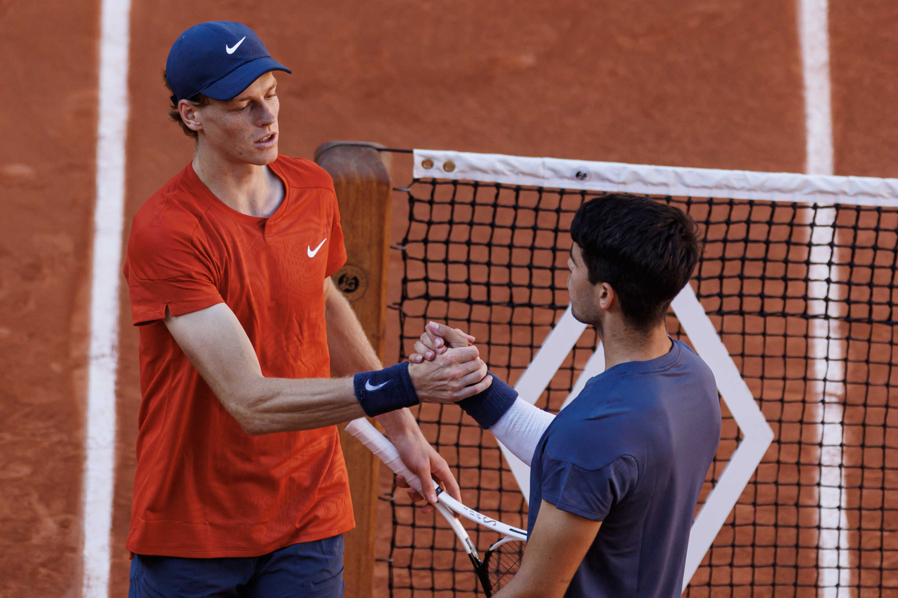 PARIS, FRANCE - JUNE 07: Carlos Alcaraz of Spain shakes hands with Jannik Sinner of Italy after beating him in the semi-final of the men's singles at Roland Garros on June 07, 2024 in Paris, France. (Photo by Frey/TPN/Getty Images)