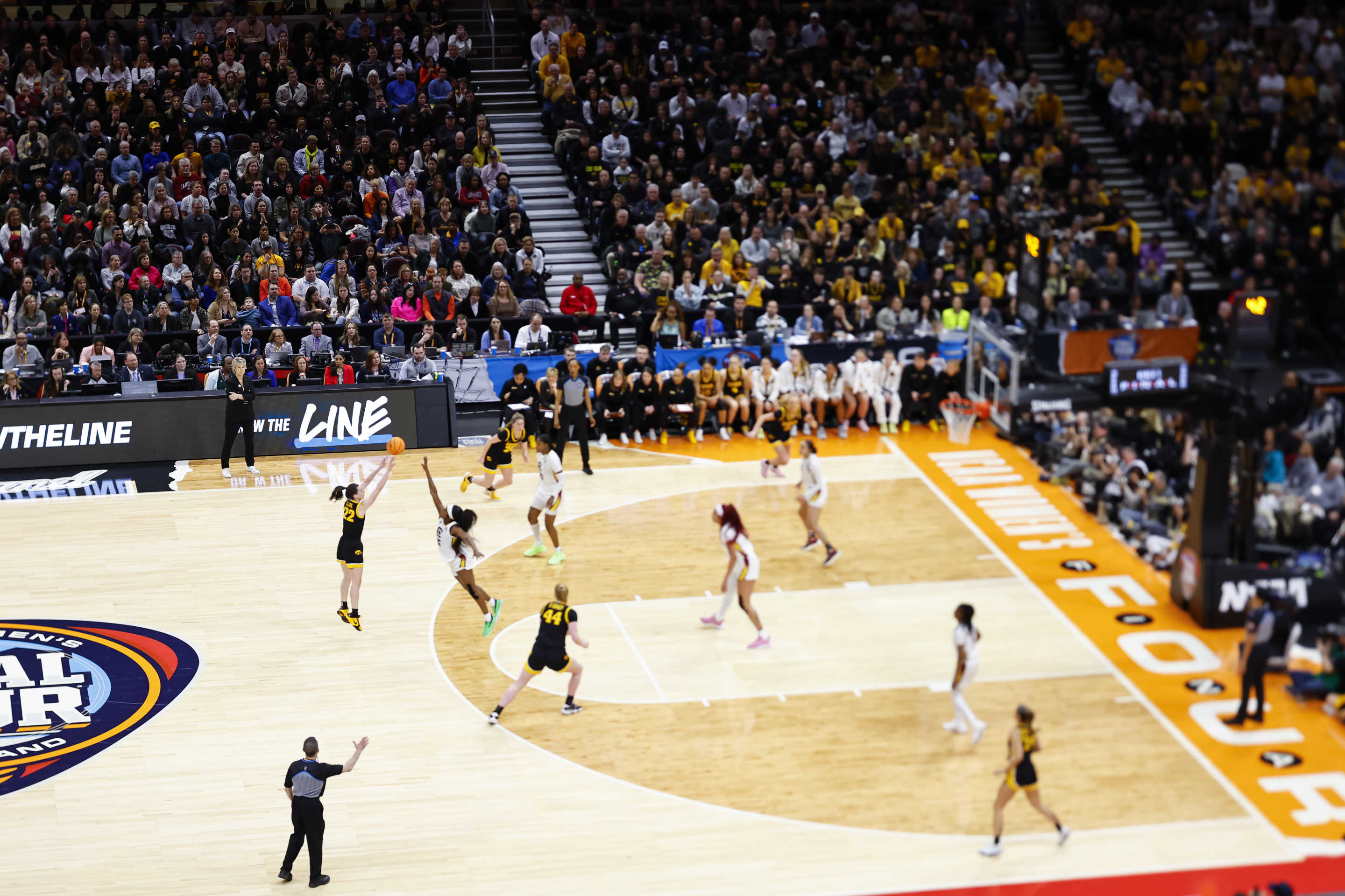 CLEVELAND, OHIO - APRIL 7: (EDITOR'S NOTE: Image is shot with a tilt shift lens.) Caitlin Clark #22 of the Iowa Hawkeyes shoots a three pointer against the South Carolina Gamecocks during the NCAA Women's Basketball Tournament National Championship at Rocket Mortgage Fieldhouse on April 7, 2024 in Cleveland, Ohio. (Photo by C. Morgan Engel/NCAA Photos via Getty Images)