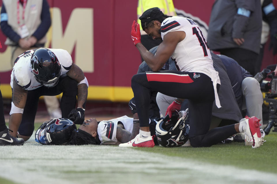 Houston Texans wide receiver Tank Dell suffered what appeared to be a serious leg injury on a touchdown. (AP Photo/Charlie Riedel)