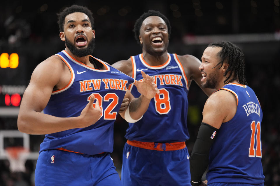 Dec 9, 2024; Toronto, Ontario, CAN; New York Knicks guard Jalen Brunson (11) and forward OG Anunoby (8) react after a three point basket by center Karl-Anthony Towns (32) to clinch a win over the Toronto Raptors during the second half at Scotiabank Arena. Mandatory Credit: John E. Sokolowski-Imagn Images