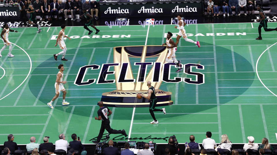 Boston, MA - November 12: Boston Celtics PG Derrick White dribbles down the green court in place for the 2024 NBA Cup in the first quarter at TD Garden. (Photo by Danielle Parhizkaran/The Boston Globe via Getty Images)