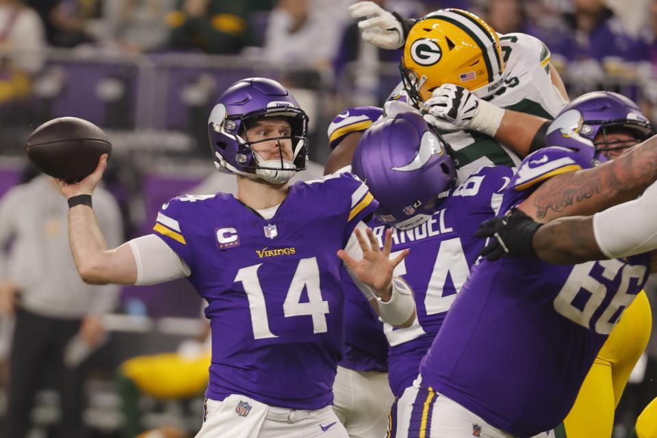 Minnesota Vikings' Sam Darnold throws during the first half of an NFL football game against the Green Bay Packers Sunday, Dec. 29, 2024, in Minneapolis. (AP Photo/Bruce Kluckhohn)