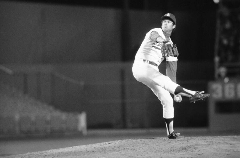 The Dodgers' Tommy John delivers during a game on April 29, 1976 against the Pirates for his first win after the procedure.