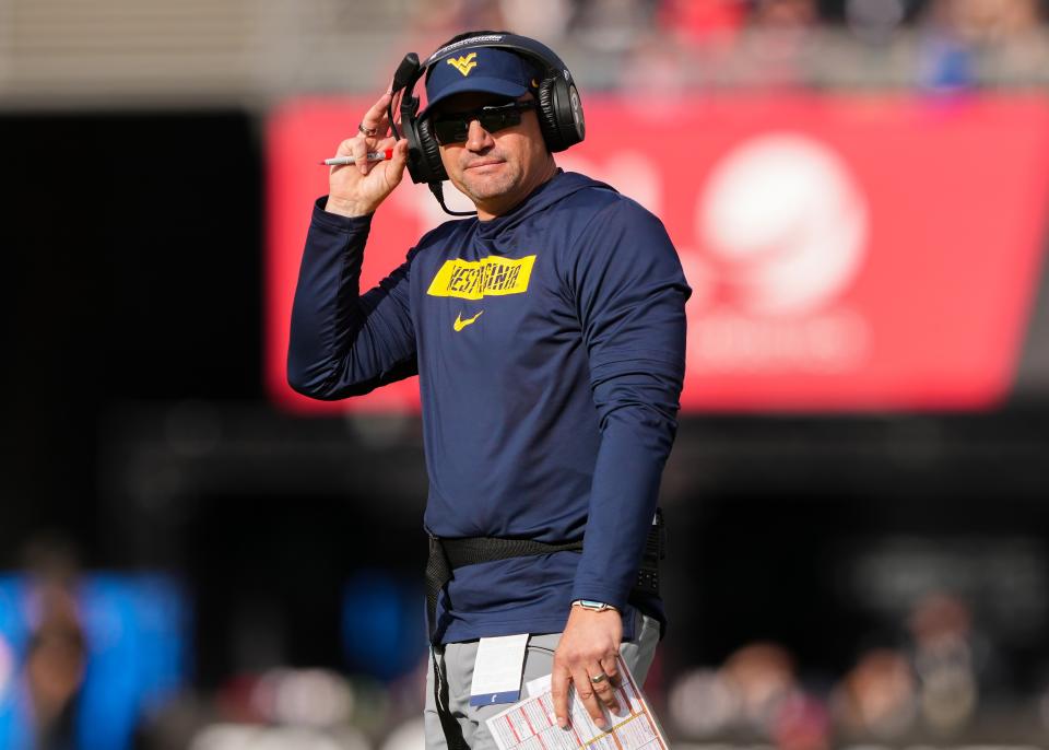 CINCINNATI, OHIO - NOVEMBER 09: Head coach Neal Brown of the West Virginia Mountaineers looks on in the fourth quarter against the Cincinnati Bearcats at Nippert Stadium on November 09, 2024 in Cincinnati, Ohio. (Photo by Dylan Buell/Getty Images)