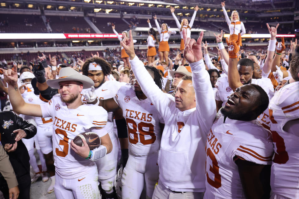 COLLEGE STATION, TEXAS - NOVEMBER 30: Quinn Ewers #3 and Head coach Steve Sarkisian of the Texas Longhorns celebrate with teammates and the fans after defeating the Texas A&M Aggies 17-7 at Kyle Field on November 30, 2024 in College Station, Texas. (Photo by Alex Slitz/Getty Images)