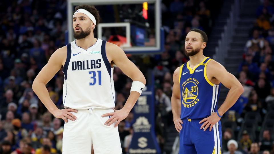 SAN FRANCISCO, CALIFORNIA - DECEMBER 15: Klay Thompson #31 of the Dallas Mavericks and Stephen Curry #30 of the Golden State Warriors stand on the court in the first half at Chase Center on December 15, 2024 in San Francisco, California. NOTE TO USER: User expressly acknowledges and agrees that, by downloading and/or using this photograph, user is consenting to the terms and conditions of the Getty Images License Agreement. (Photo by Ezra Shaw/Getty Images)