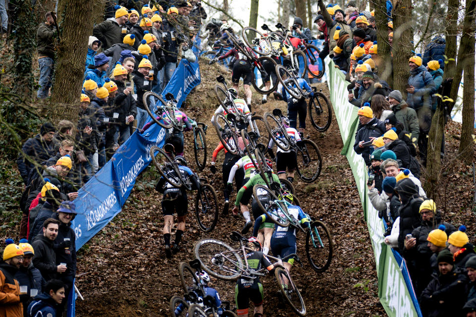 The peloton climbs a hill during a women's elite cyclocross race on Saturday. (Billy Ceusters/Getty Images)