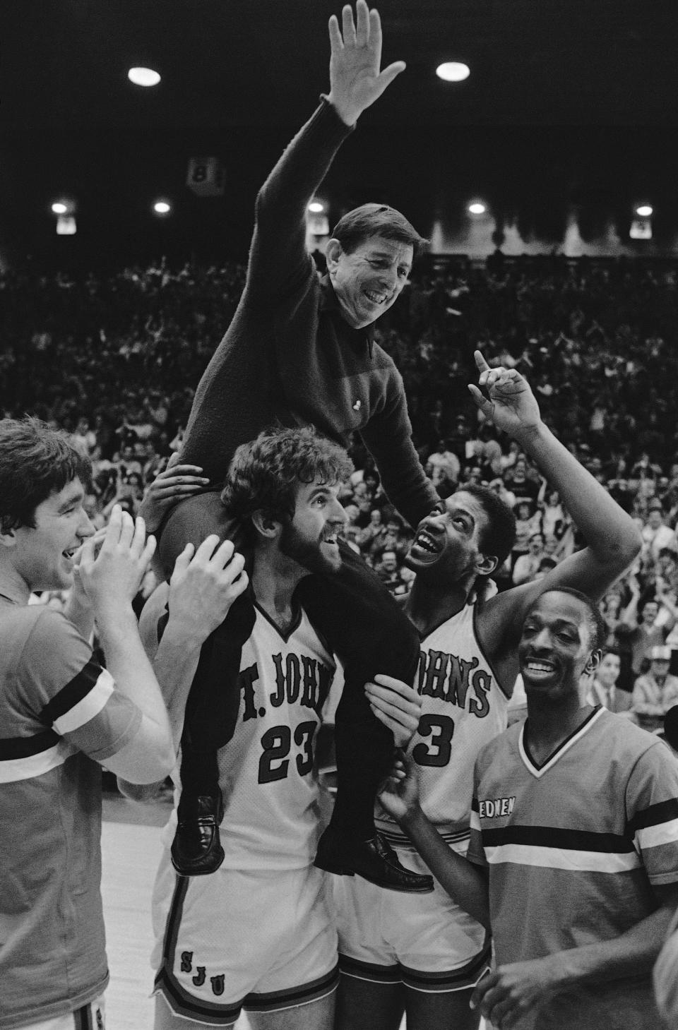 Coach Carnesecca is carried off the court by his players following a victory over Providence in 1985. (AP Photo)