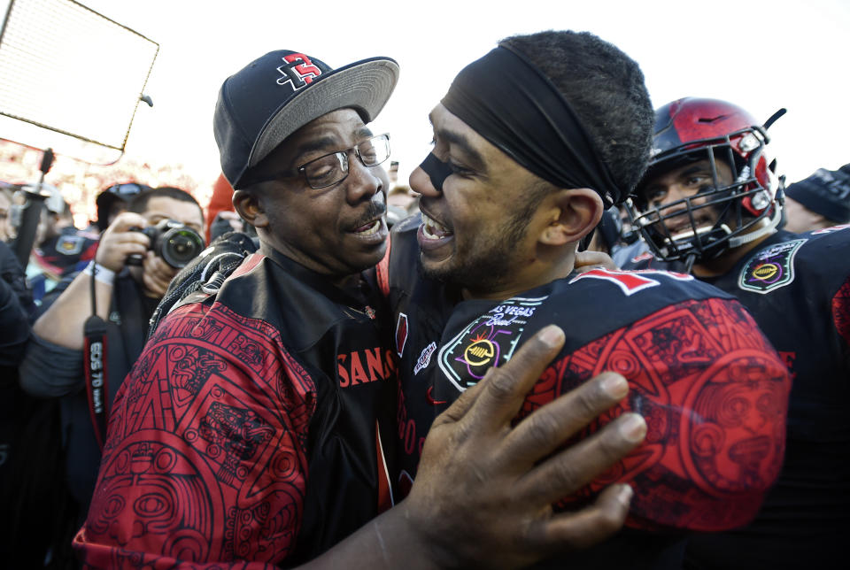 Donnel Pumphrey Sr. congratulates his son after he made history at the Las Vegas Bowl. (David Becker/AP Photo)