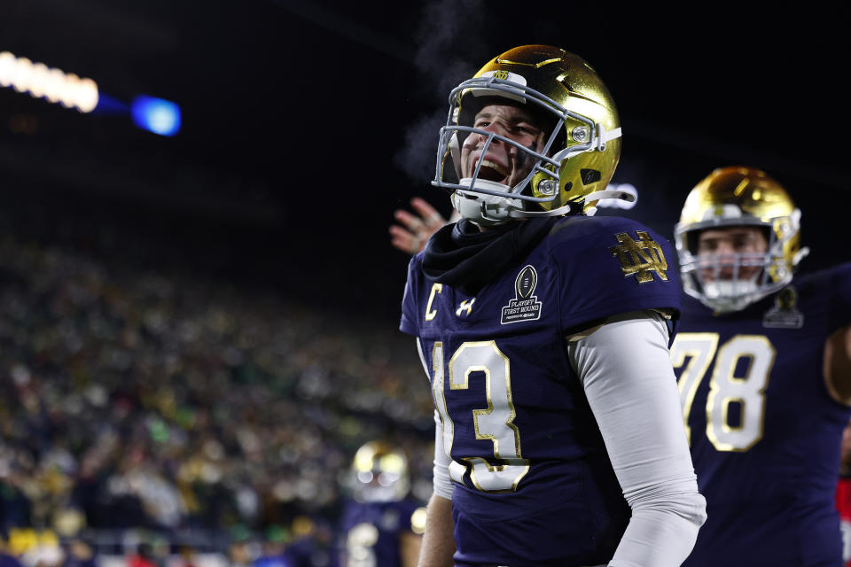 SOUTH BEND, IN - DECEMBER 20: Notre Dame Fighting Irish quarterback Riley Leonard (13) celebrates his touchdown during the CFP first round game between the Indiana Hoosiers and Notre Dame Fighting Irish on December 20, 2024 at Notre Dame Stadium in South Bend, IN. (Photo by Jeffrey Brown/Icon Sportswire via Getty Images)