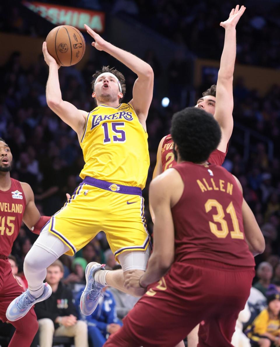 Laker Austin Reaves drives to the basket against the Cavaliers during the fourth quarter at Crypto.com Arena Tuesday.