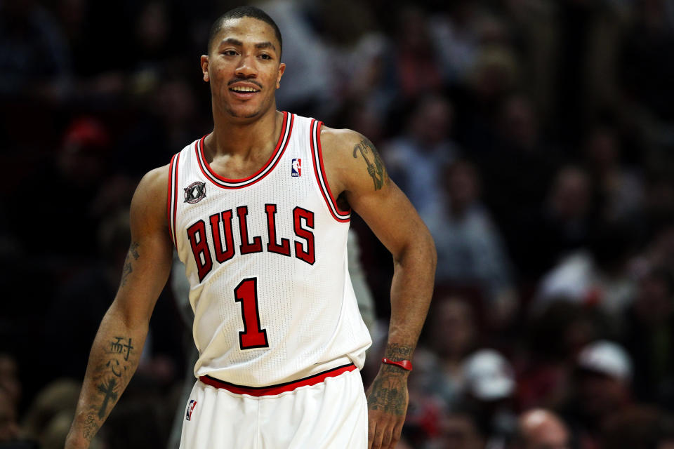 Bulls point guard Derrick Rose has a laugh with teammates during a game against the Cavaliers on Jan. 1, 2011, at the United Center in Chicago. (Chris Sweda/Chicago Tribune/Tribune News Service via Getty Images)