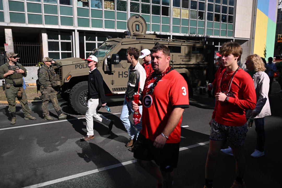 Law enforcement officers stand guard next to a Homeland Security Investigations armored vehicle outside of the Superdome ahead of the Sugar Bowl college football game on January 2, 2025 in New Orleans, Louisiana, following a terrorist attack on January 1. At least 15 people were killed and 30 injured on January 1 when a vehicle plowed overnight into a New Year's crowd in the heart of the thriving New Orleans tourist district, authorities in the southern US city said. (Photo by ANDREW CABALLERO-REYNOLDS / AFP) (Photo by ANDREW CABALLERO-REYNOLDS/AFP via Getty Images)