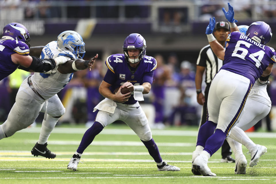 MINNEAPOLIS, MINNESOTA - OCTOBER 20: Sam Darnold #14 of the Minnesota Vikings avoids a sack during the second half of an NFL football game against the Detroit Lions at U.S. Bank Stadium on October 20, 2024 in Minneapolis, MN. (Photo by Kevin Sabitus/Getty Images)