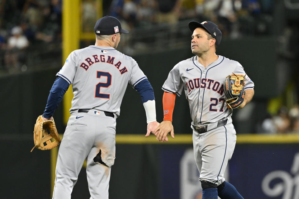 SEATTLE, WASHINGTON - JULY 19: Alex Bregman #2 and Jose Altuve #27 of the Houston Astros shakes hands after the game against the Seattle Mariners at T-Mobile Park on July 19, 2024 in Seattle, Washington. The Houston Astros won 3-0. (Photo by Alika Jenner/Getty Images)