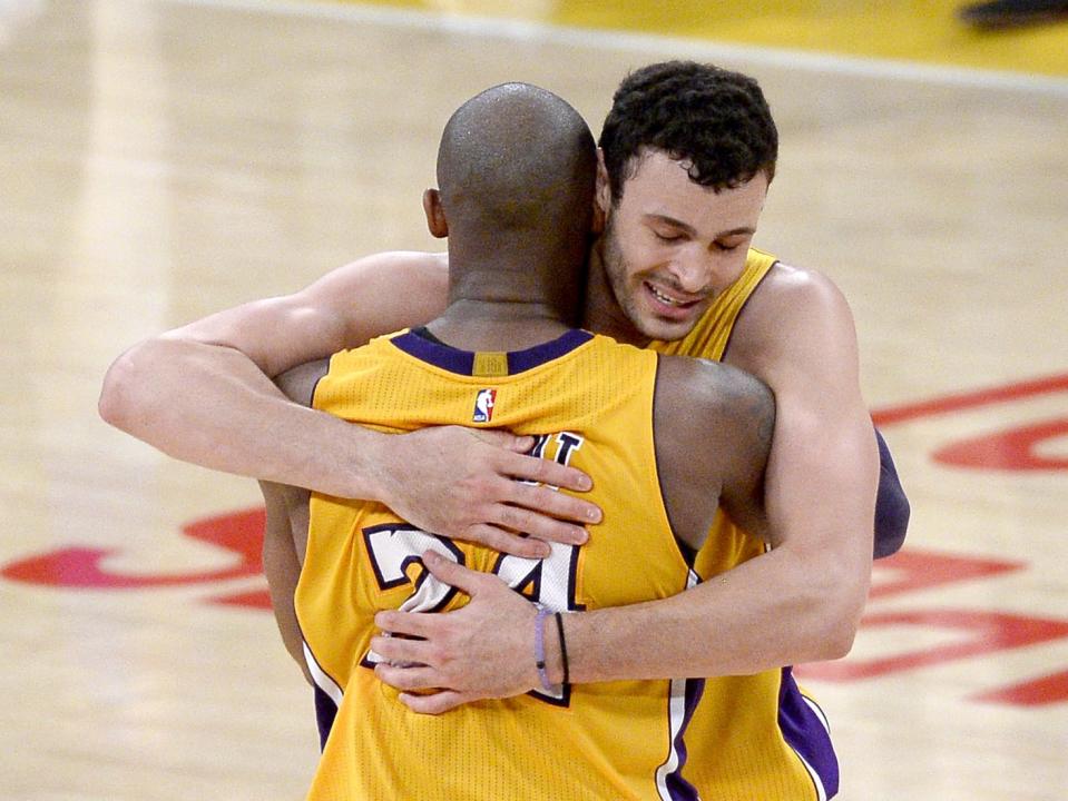 LOS ANGELES, CA - APRIL 13: Kobe Bryant #24 of the Los Angeles Lakers hugs Larry Nance Jr. #7 after scoring 60 points against the Utah Jazz at Staples Center on April 13, 2016 in Los Angeles, California. Bryant played his last game as a Laker and retired from basketball. (Photo by Kevork Djansezian/Getty Images)