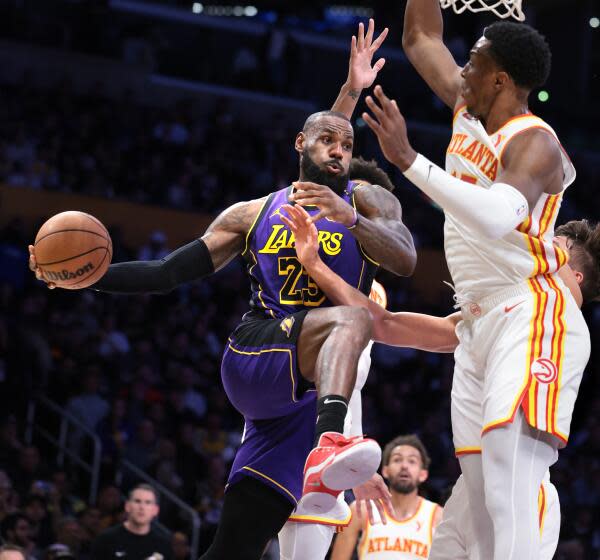 Los Angeles, California January 3, 2025-Lakers LeBron James gets a pass off against the Hawks defense.