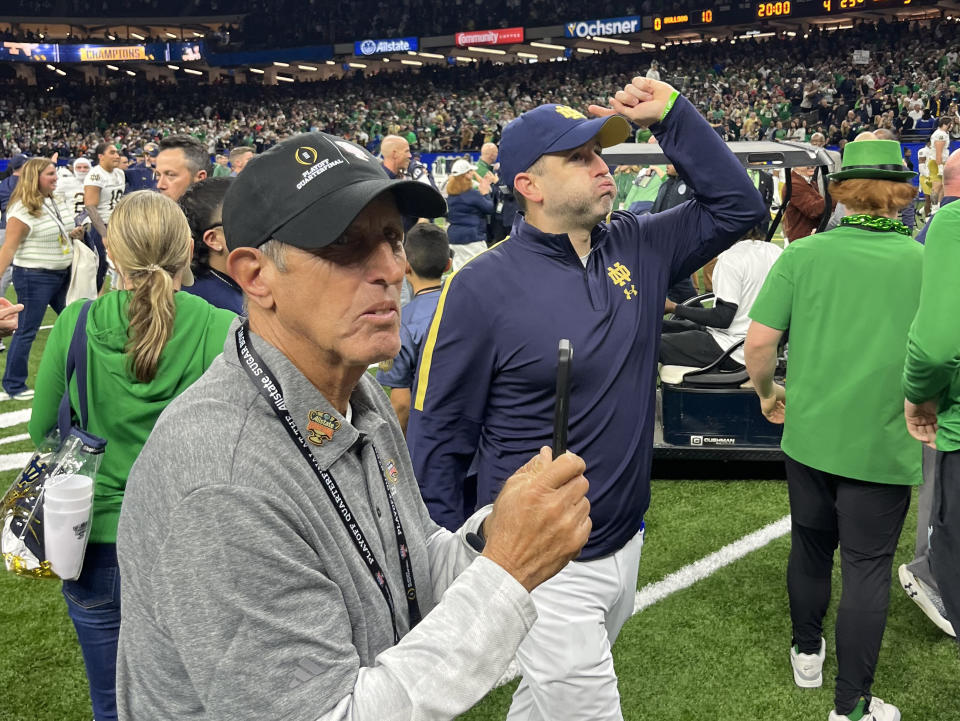 Notre Dame special teams coach Marty Biagi (right) breathes a sigh of relief after his team's win on Thursday. (Ross Dellenger/Yahoo Sports)