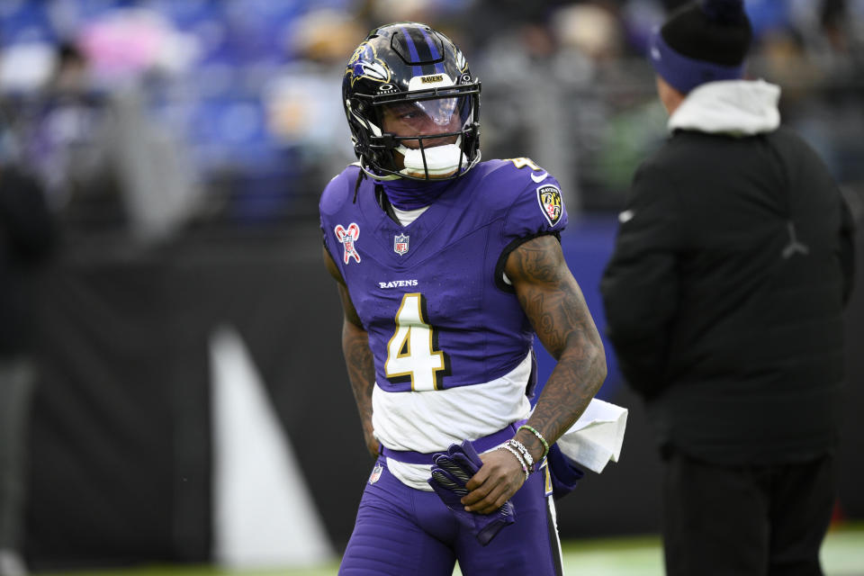 Baltimore Ravens wide receiver Zay Flowers (4) works out before an NFL football game against the Pittsburgh Steelers, Saturday, Dec. 21, 2024, in Baltimore. (AP Photo/Nick Wass)