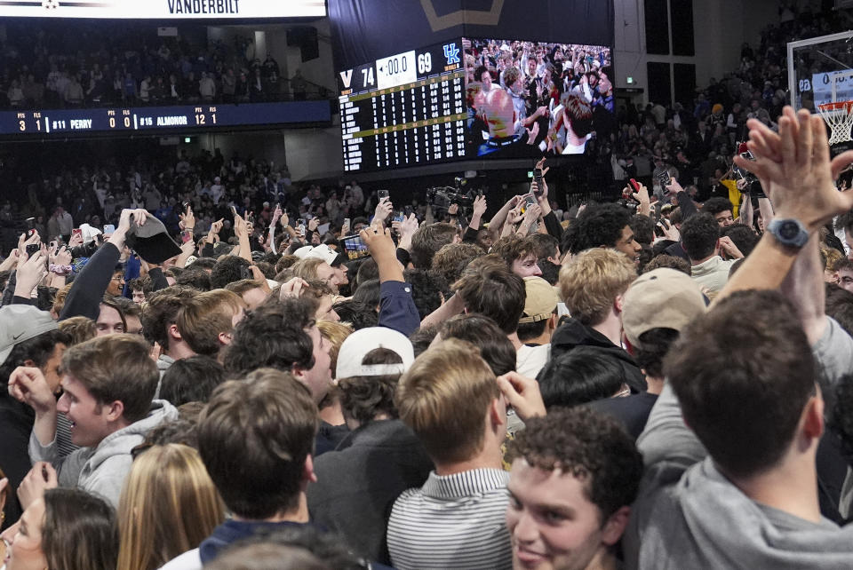 Vanderbilt fans storm the court after the team's win against Kentucky in an NCAA college basketball game Saturday, Jan. 25, 2025, in Nashville, Tenn. (AP Photo/George Walker IV)