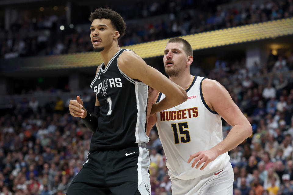 DENVER, COLORADO - JANUARY 03: Victor Wembanyama #1 of the San Antonio Spurs is guarded by Nikola Jokic #15 of the Denver Nuggets in the fourth quarter at Ball Arena on January 03, 2025 in Denver, Colorado. NOTE TO USER: User expressly acknowledges and agrees that, by downloading and or using this photograph, User is consenting to the terms and conditions of the Getty Images License Agreement. (Photo by Matthew Stockman/Getty Images)